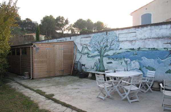 Back of garden with mural, garden shed and pool